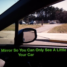 You should only see a little bit of the car with your side view mirror adjust properly